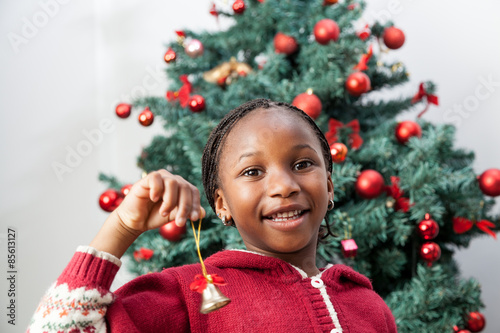 Girl holding Christmas decoration