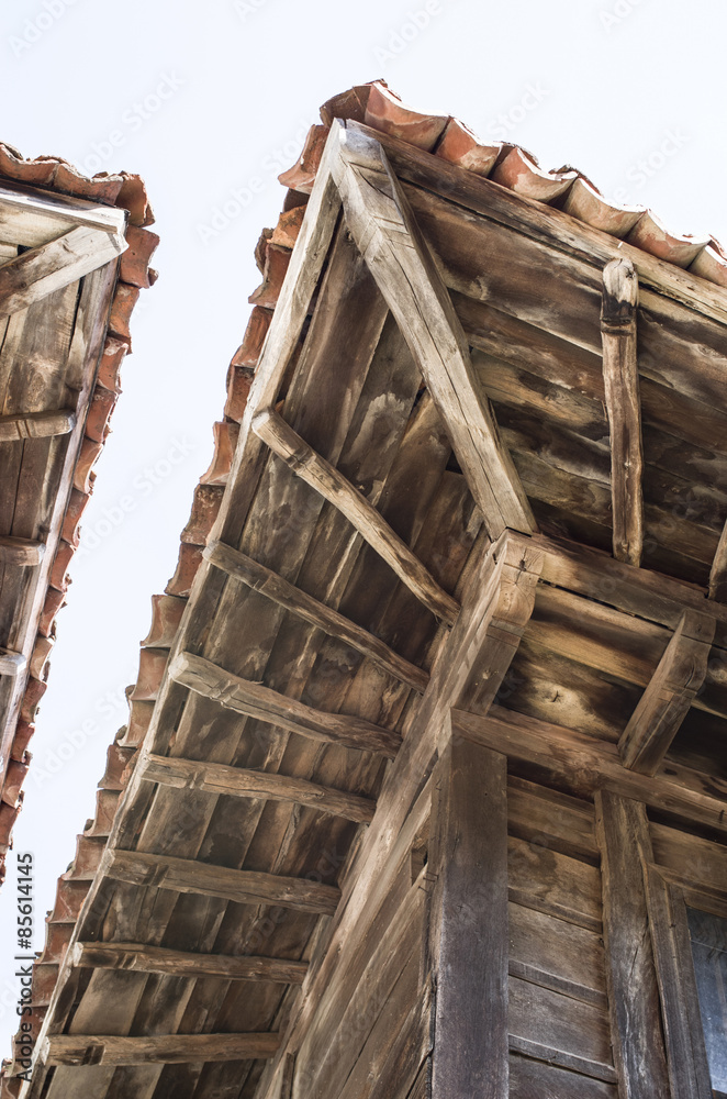 Fototapeta premium Old two wooden eaves on close house , Bulgaria