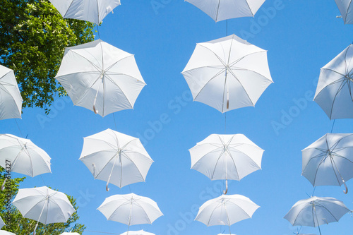 White umbrellas canes in the sky © Viktoriya09