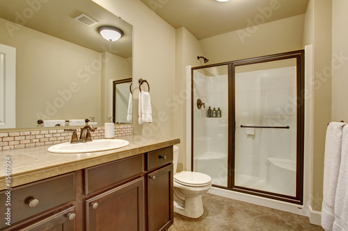 Elegant bathroom with tile floor.