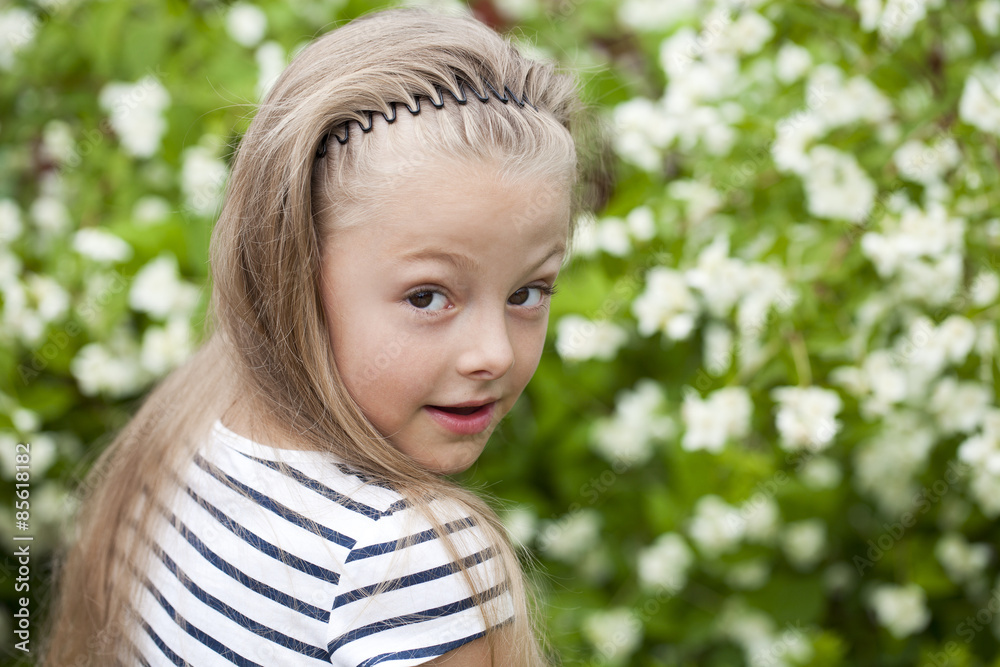 Close up portrait of a seven year little girl, against backgroun Close up portrait of a seven year little girl, against backgroun