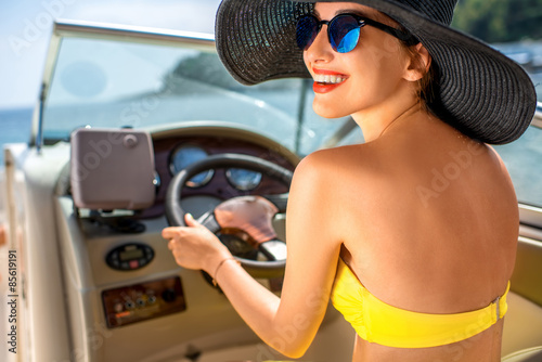 Woman driving yacht