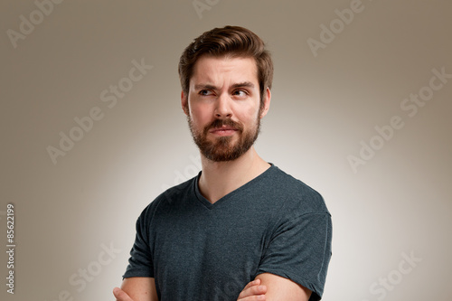 Foto Portrait of young man with beard, think about