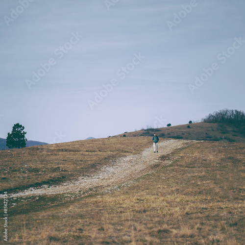 Fototapeta Naklejka Na Ścianę i Meble -  Hiker man walking in the mountains