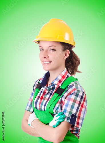 Woman builder against the gradient 