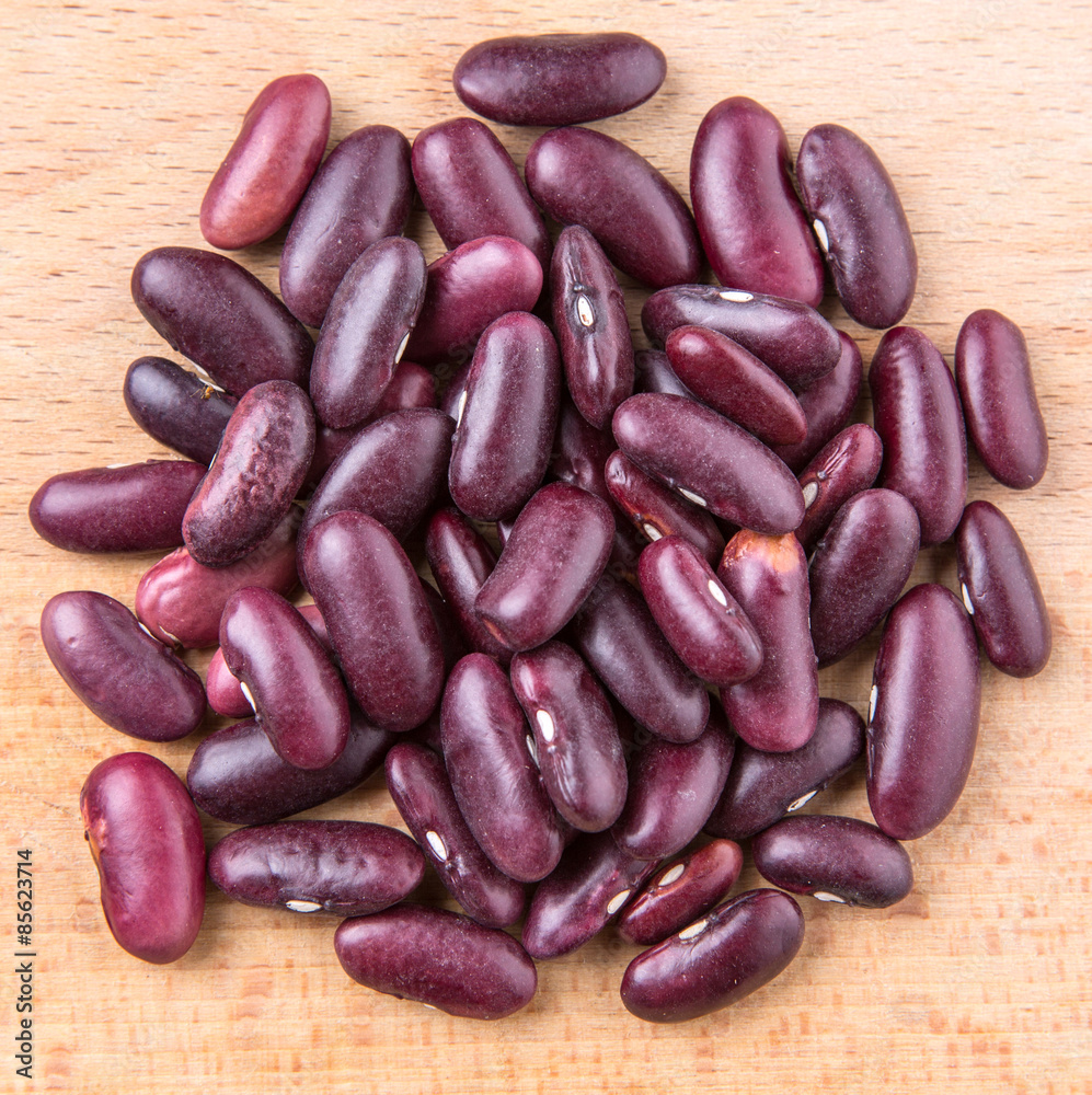 Red kidney beans on wooden background Red kidney beans on wooden background