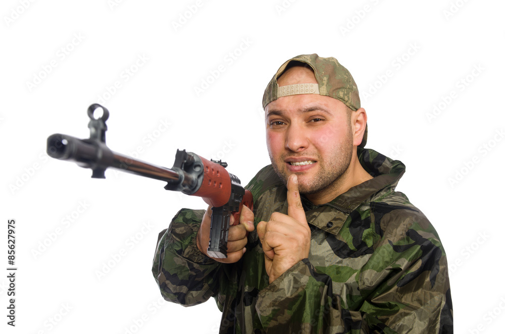 Young man in soldier uniform holding gun isolated on white Young man in soldier uniform holding gun isolated on white