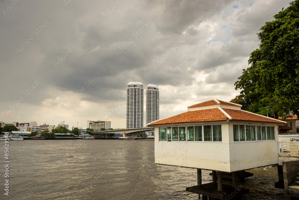Private buildings along river in Bangkok
