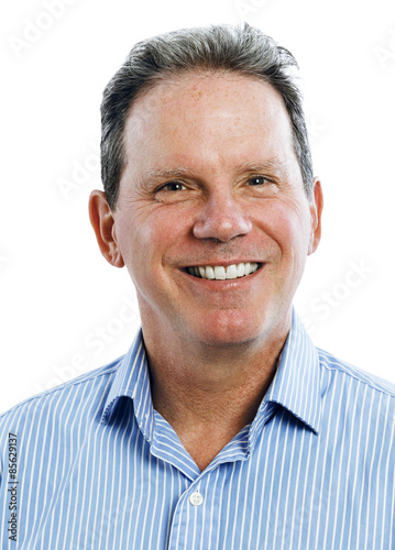 Portrait of a smiling middle aged man with grey hair on a white