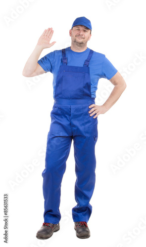 Worker in blue overalls. 