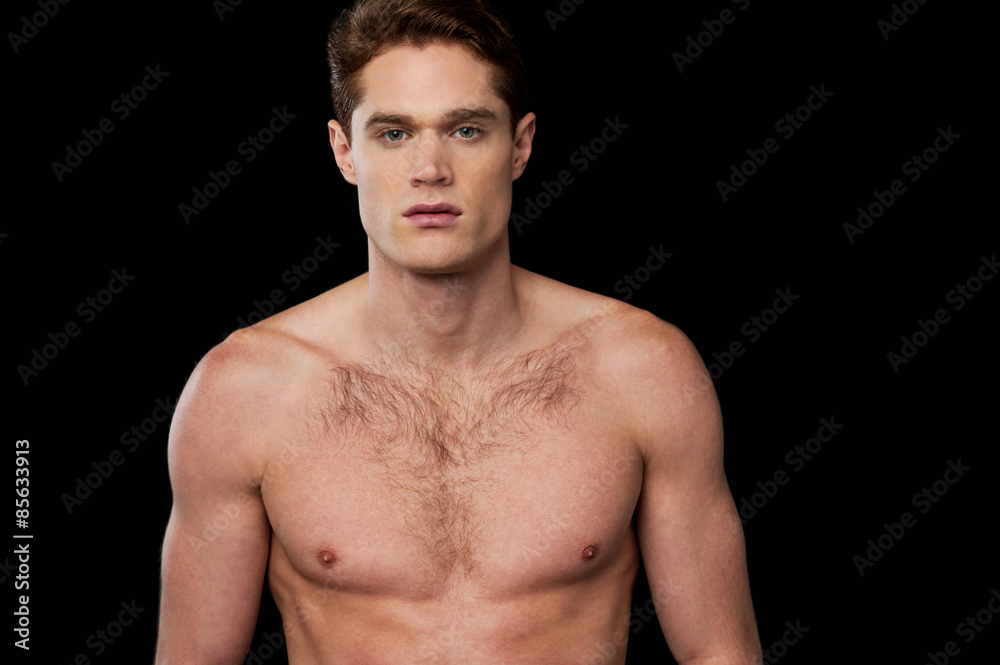 Muscular man posing over black Muscular man posing over black