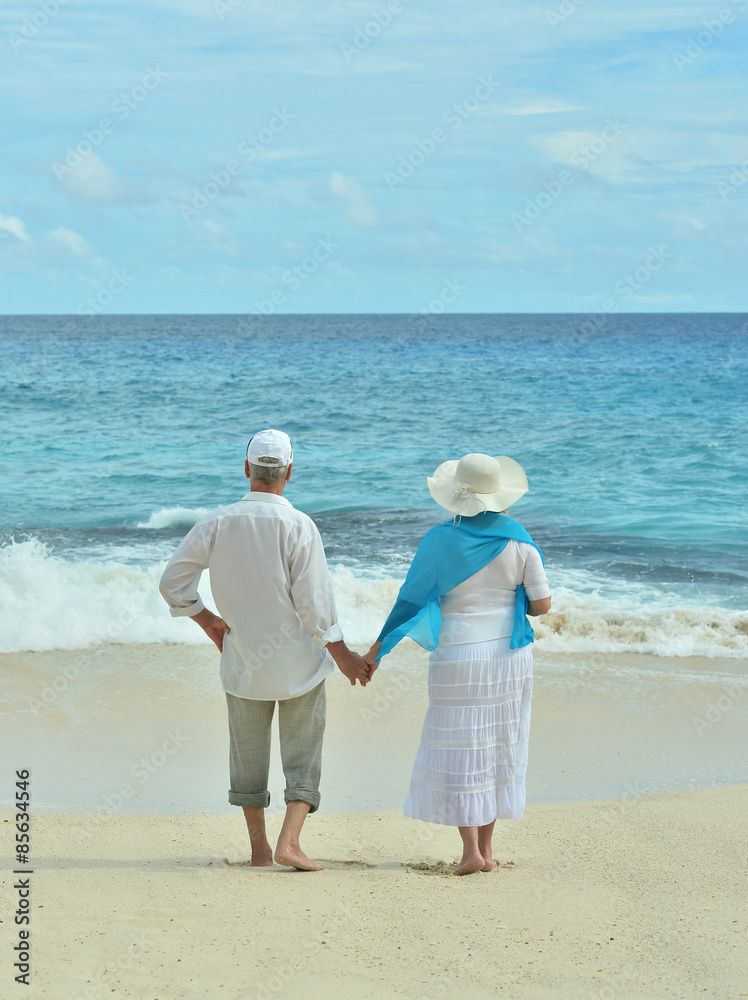 Elderly couple rest at tropical resort Elderly couple rest at tropical resort