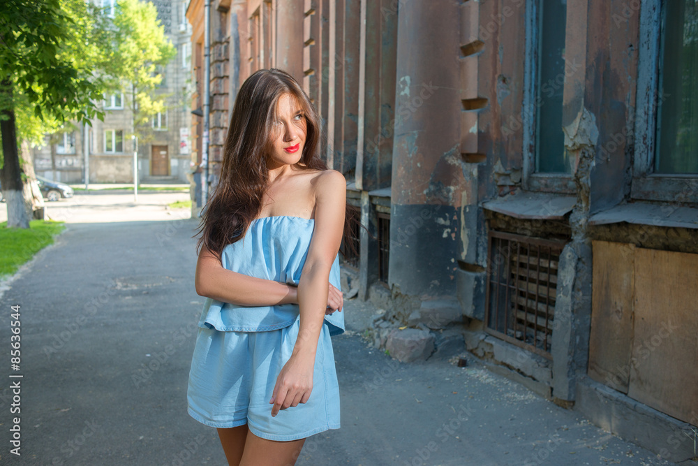 Girl with red lips in blue wearing
