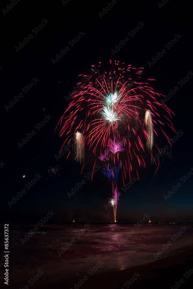 fireworks reflecting in the water during Forte dei Marmi Interna fireworks reflecting in the water during Forte dei Marmi Interna