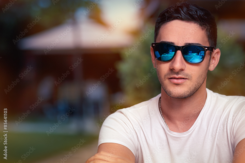 Man Wearing Sunglasses Waiting in a Restaurant Man Wearing Sunglasses Waiting in a Restaurant