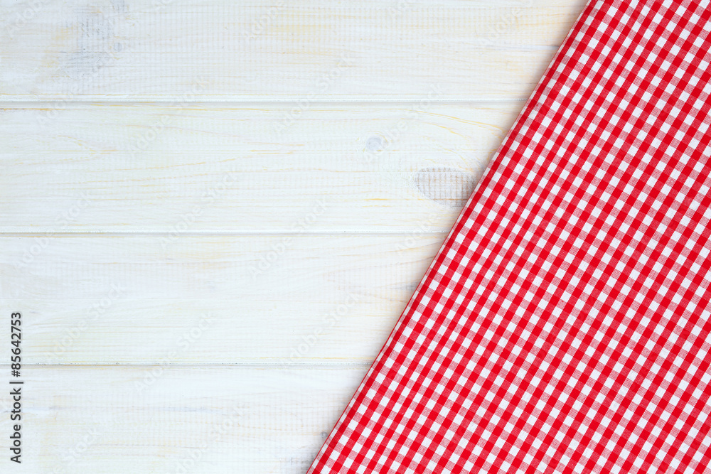 Red towel over wooden kitchen table. View from above with copy s Red towel over wooden kitchen table. View from above with copy s