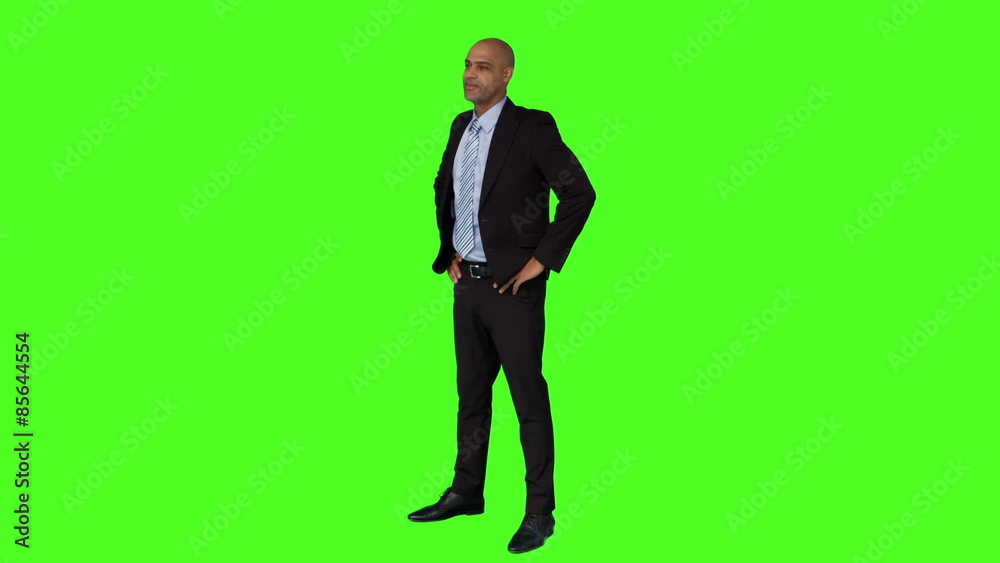 Businessman standing with hands on hips Businessman standing with hands on hips