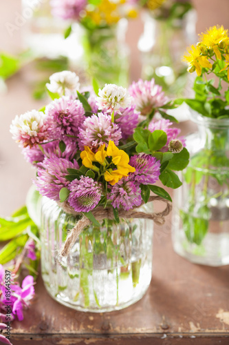 colorful medical flowers and herbs in jars