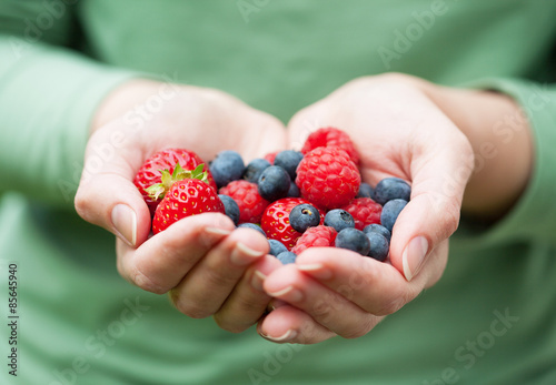 hands holding fresh berries