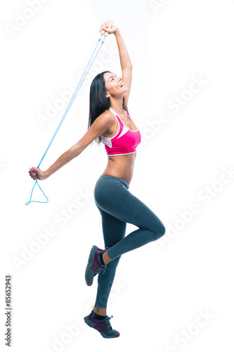 Fitness woman stretching with skipping rope