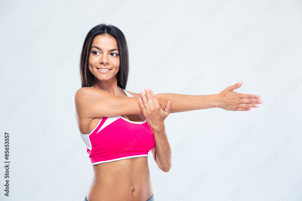Happy sports woman stretching hands