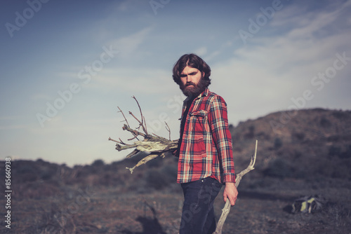 Man collecting firewood for cooking
