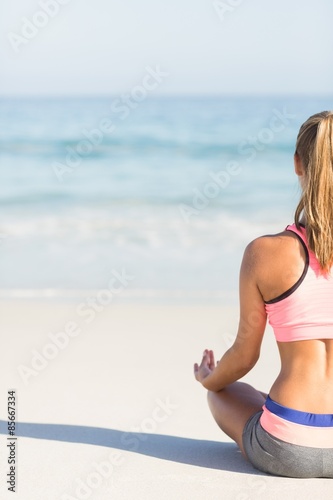 Fit woman doing yoga beside the sea  © WavebreakmediaMicro