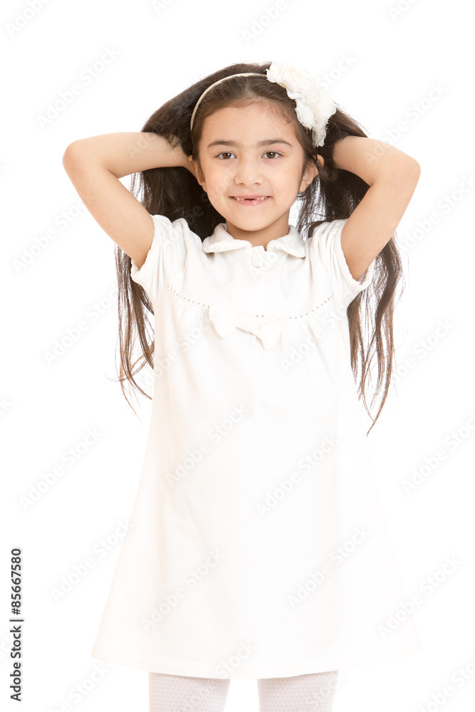 Portrait of slim,handsome, dark-haired girl in a white dress Portrait of slim,handsome, dark-haired girl in a white dress