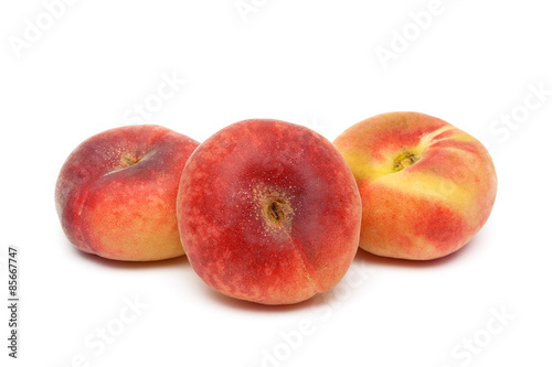 Three ripe peach close-up on a white background