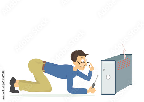 Young computer technician trying to fix a broken computer