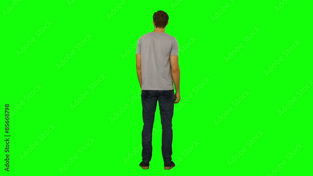 Casual man standing and looking around Casual man standing and looking around