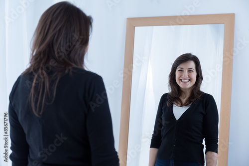 Girl wearing a fake smile