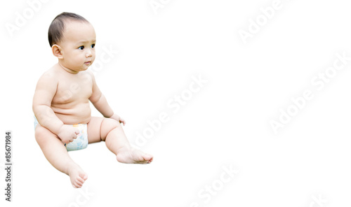 baby sitting on white background with space on the right of photo