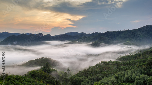 Layer of mountains in the mist at sunrise time, Baan Nai Wong, Ranong Province, Thailand © Southtownboy Studio
