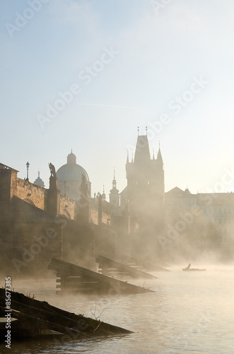 Charles bridge in Prague in the morning mist