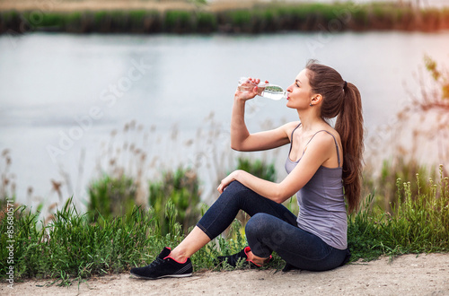 Photos outdoor photo of pretty young woman wearing sportive clothes and