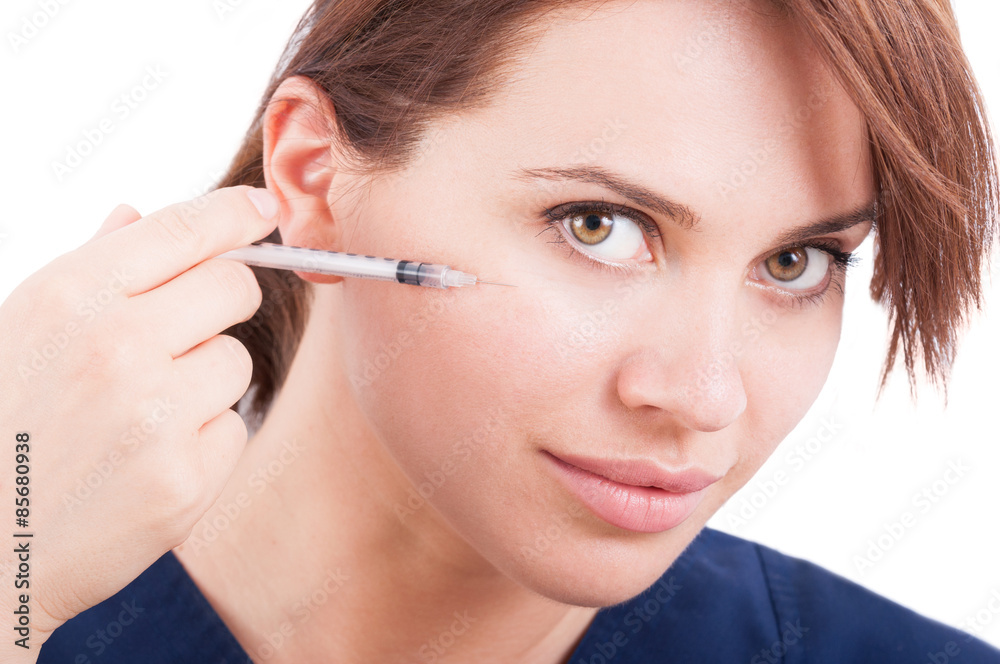 Plastic surgery doctor injecting botox near eye Plastic surgery doctor injecting botox near eye