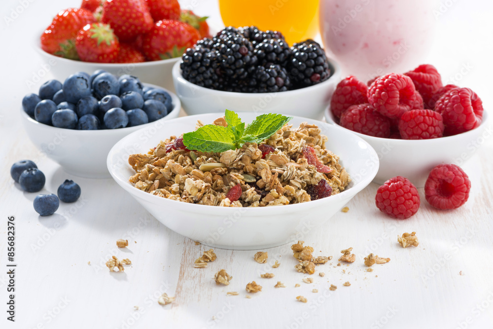 delicious and healthy breakfast with berries on white wood delicious and healthy breakfast with berries on white wood