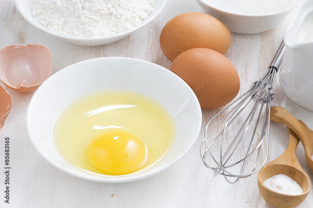 ingredients for baking on a white wooden table, close-up ingredients for baking on a white wooden table, close-up