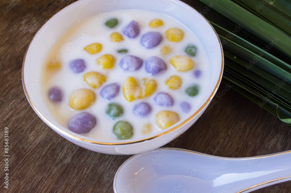 Dumplings in coconut cream (Bua Loi) on Thai silk, Dessert of Th Dumplings in coconut cream (Bua Loi) on Thai silk, Dessert of Th