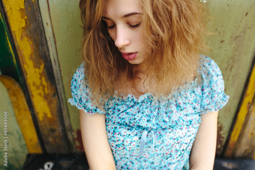 Fototapeta premium Portrait of a beautiful red-haired girl