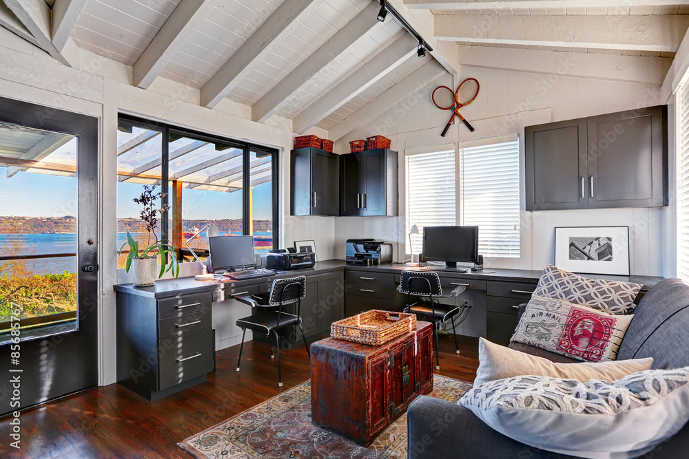 Classic large bright home office interior with modern and antiqu Stock ...