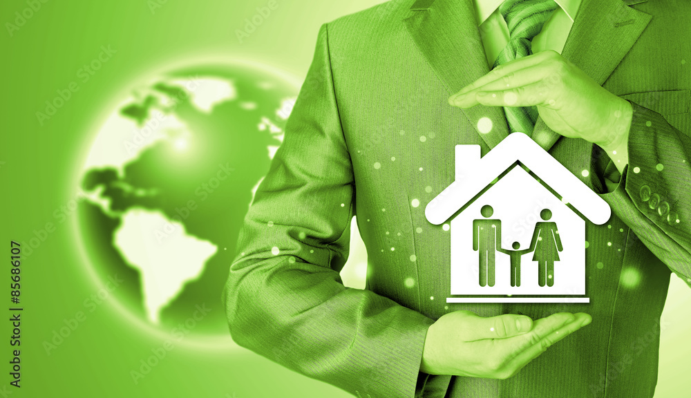 businessman protecting family in home with hands businessman protecting family in home with hands
