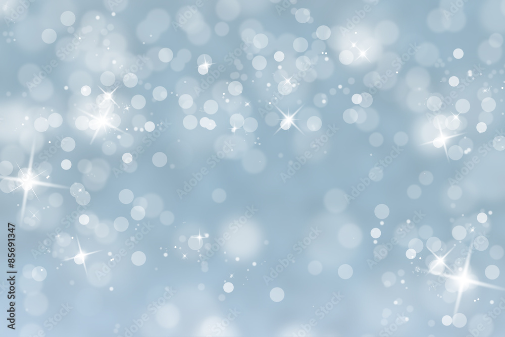 Blurry abstract bokeh lights on light blue background with sparkle. Beautiful snowy holiday greeting card illustration with place for text. Blurry abstract bokeh lights on light blue background with sparkle. Beautiful snowy holiday greeting card illustration with place for text.