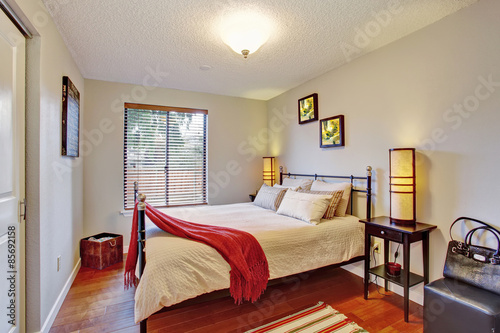 Georgous master bedroom with hardwood floor.