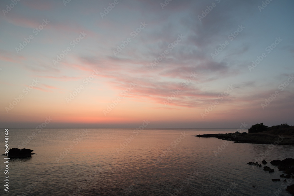 Rocky sea coast right before sunrise