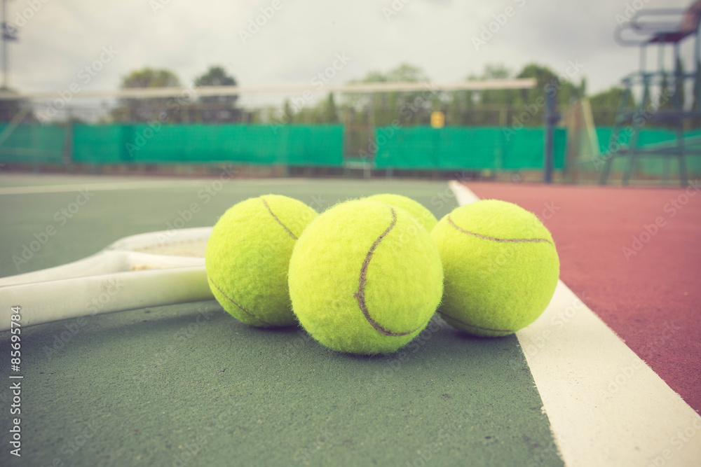 tennis racket and balls on the tennis court vintage color