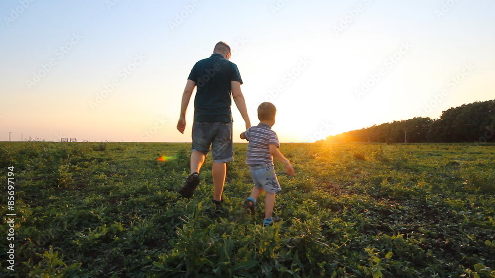 Father and his son laying in the park Father and his son laying in the park