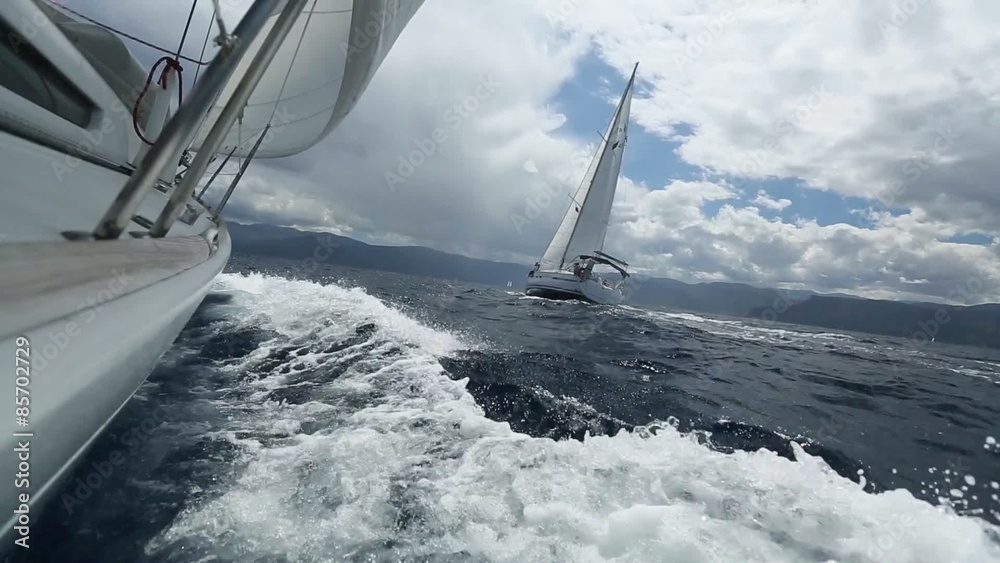 Sailing in the wind through the waves. (HD)