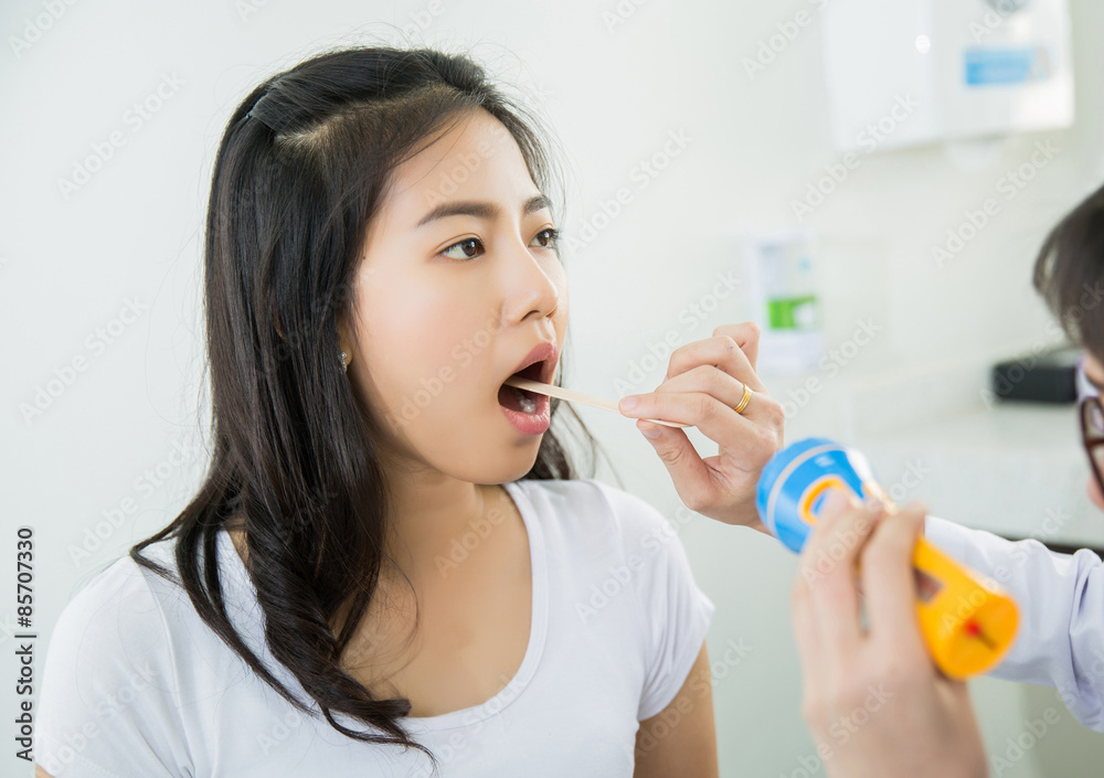 Doctor checking mouth Doctor checking mouth